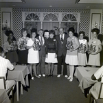 Nine Sarah Coventry Employees Pose for a Photo During a Company Event at the Manger Motor Inn by George Skip Gandy IV