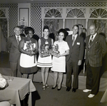 Six Sarah Coventry Employees Pose for a Photo During a Company Event at the Manger Motors Inn, A by George Skip Gandy IV