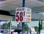 Fuel Price Flip Sign at Self Service Island by George Skip Gandy IV