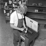 Dancey Employee Cleaning Metal Parts, E by George Skip Gandy IV