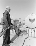 Delaware Marine Worker Operating Fuel System, E by George Skip Gandy IV