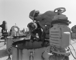 Delaware Marine Worker Operating Fuel System, F by George Skip Gandy IV