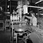 Woman Overlooking a Processing Machine, B by George Skip Gandy IV