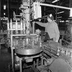 Woman Overlooking a Processing Machine, C by George Skip Gandy IV