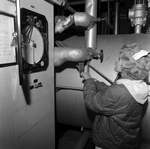 Women Monitoring a Control Panel, D by George Skip Gandy IV