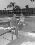 Two Women Relaxing by a Poolside, B by George Skip Gandy IV