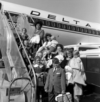 Families with Children Boarding a Delta Airlines Aircraft, A by George Skip Gandy IV