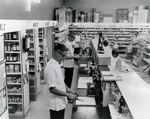 Pharmacy Counter at an Eckerd Drugstore, St. Petersburg, Florida, A by George Skip Gandy IV