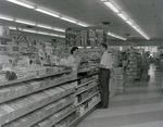 Cashier at Eckerd Drugstore, St. Petersburg, Florida by George Skip Gandy IV