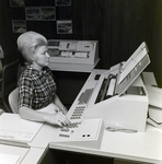 Woman Works on Eckerd Drugstores Account at Tully-Menard, Tampa, Florida, A by George Skip Gandy IV