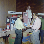 William Tucker and F. Schneider Speak with Owens-Corning Fiberglas Representative, B by George Skip Gandy IV