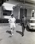 Ship Captain and Man Outside Eller & Company Building, Tampa, Florida, B by George Skip Gandy IV