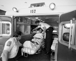 Paramedics Helping Woman Ambulance, B by Skip Gandy