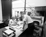 EMS Office with Ambulance Outside Window, C by Skip Gandy