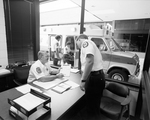 EMS Office with Ambulance Outside Window, F by Skip Gandy