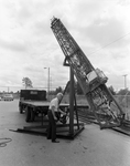 E-Z Way Products Metal Tower is Lifted Off Truck, B by Skip Gandy