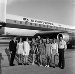 Men and Women with Eastern Air Lines Airplane, B by Skip Gandy