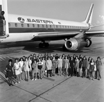 Young Women with Eastern Air Lines Airplane, C by Skip Gandy