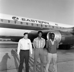 Men with Eastern Air Lines Airplane, A by Skip Gandy