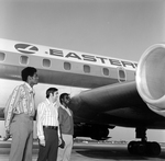 Men with Eastern Air Lines Airplane, B by Skip Gandy