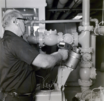 Technician Performing Equipment Inspection, A by George Skip Gandy IV