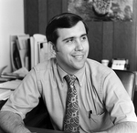 Man in Paisley Tie Sitting at Desk, Tampa, Florida, A by George Skip Gandy IV