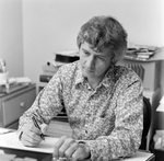 Man in Floral Shirt Working at Desk, Tampa, Florida, A by George Skip Gandy IV