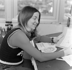 Woman Sitting at Desk with Design Work, Tampa, Florida, E by George Skip Gandy IV