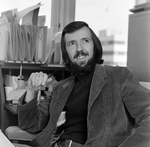 Man Working at Desk with Pen, Tampa, Florida, B by George Skip Gandy IV