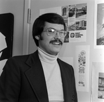 Man with Glasses at Desk in Tampa, Florida, E by George Skip Gandy IV