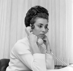 Woman on Phone at Desk, Tampa, Florida by George Skip Gandy IV