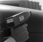 Microsonic Leak Detector Held by Technician, A by George Skip Gandy IV