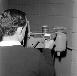 Man Using Microsonic Leak Detector on Industrial Equipment, B by George Skip Gandy IV