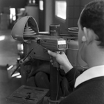 Man Using Microsonic Leak Detector on Industrial Equipment, F by George Skip Gandy IV