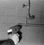 Technician Using Microsonic Leak Detector on Piping, B by George Skip Gandy IV