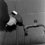 Technician Using Microsonic Leak Detector on Piping, E by George Skip Gandy IV