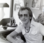 Man at Desk with Sunglasses, C by George Skip Gandy IV