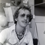 Man at Desk with Sunglasses, F by George Skip Gandy IV