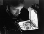 Man Inspecting Electrical Equipment, C by George Skip Gandy IV