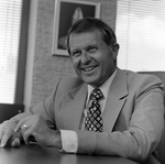 Man in Suit Speaking in Office, F by George Skip Gandy IV