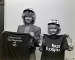 Two Employees Displaying Company Shirts, First Florida Bank Meeting, B by George Skip Gandy IV
