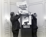 Two Employees Cover Sign, First Florida Bank Event by George Skip Gandy IV