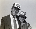 Two Employees Pose Wearing Company Hats, First Florida Bank by George Skip Gandy IV
