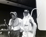 Two First Florida Bank Employees in Costume Present at Podium, Daytona, B by George Skip Gandy IV