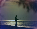 Man fishing from shoreline, Freeport, Grand Bahama Island, Bahamas