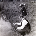 Jerry Bowmer and Developers Evaluate Irrigation Ditch on Site in Tampa, Florida, B by Skip Gandy