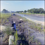 A Muddy Ditch Next to a Street, Tampa, Florida, A by George Skip Gandy IV