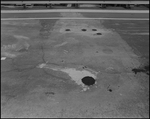 Five Potholes Filled with Asphalt, Tampa, Florida, A by George Skip Gandy IV