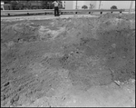 Man Stands on Edge of Large Excavation at Expressway Site, Tampa, Florida by George Skip Gandy IV