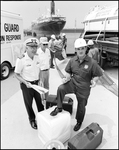 Coast Guard Officer and Crew from Chevron Prepare to Deploy Tools, Tampa, Florida, A by George Skip Gandy IV